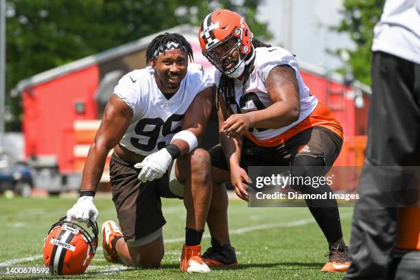 Myles Garrett and Sheldon Day of the Cleveland Browns pose for a photo during the Cleveland Browns offseason workout at CrossCountry Mortgage Campus...