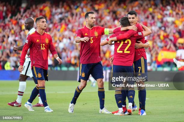 Alvaro Morata of Spain celebrates with teammates Ferran Torres, Sergio Busquets and Pablo Sarabia after scoring their team's first goal during the...