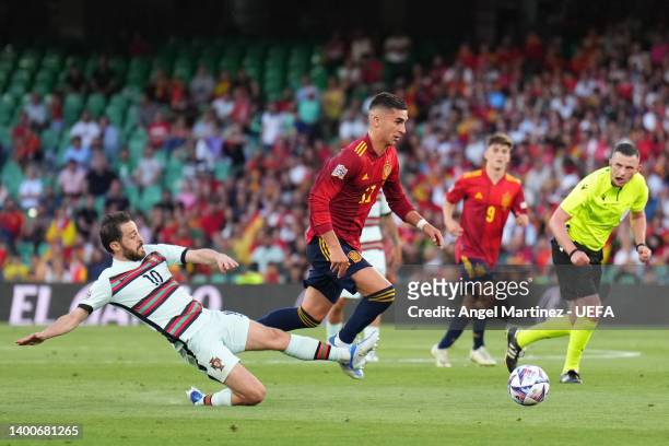 Ferran Torres of Spain is fouled by Bernardo Silva of Portugal during the UEFA Nations League League A Group 2 match between Spain and Portugal at...
