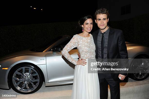 Actress Torrey DeVitto and actor Paul Wesley arrive at Audi Arrivals at 20th annual Elton John AIDS Foundation Academy Awards viewing party on...