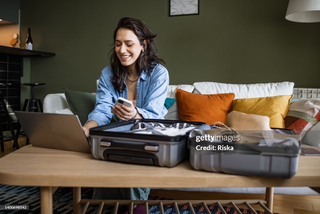 Woman using laptop to book travel reservation