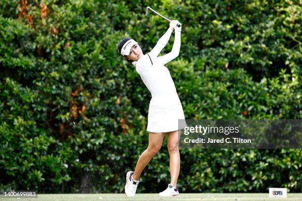 Muni He of China plays her tee shot on the 16th hole during the first round of the 77th US Women's Open Championship at Pine Needles Lodge and Golf...