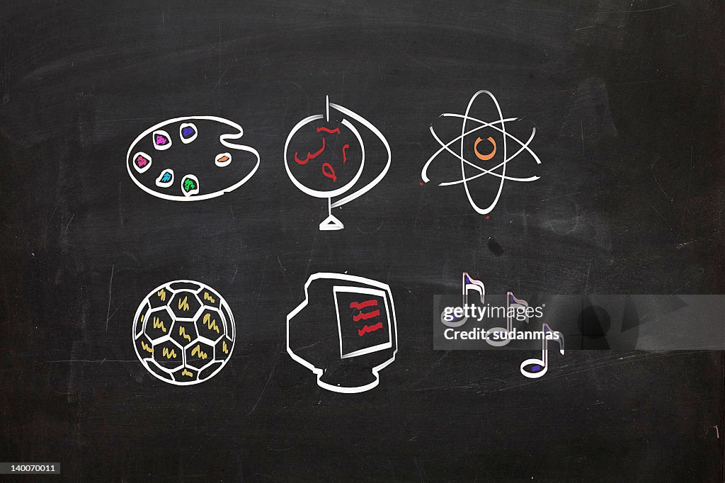Blackboard with school subjects images
