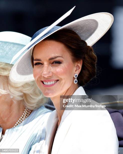 Catherine, Duchess of Cambridge travels down The Mall in a horse drawn carriage during Trooping the Colour on June 2, 2022 in London, England....
