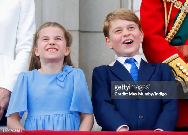 Princess Charlotte of Cambridge and Prince George of Cambridge watch a flypast from the balcony of Buckingham Palace during Trooping the Colour on...