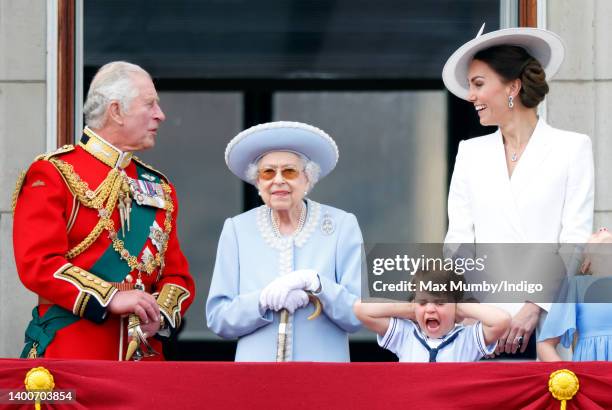 Prince Charles, Prince of Wales, Queen Elizabeth II, Prince Louis of Cambridge and Catherine, Duchess of Cambridge watch a flypast from the balcony...