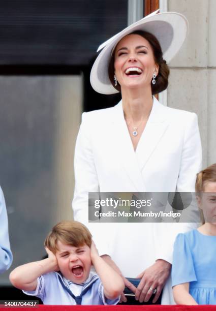 Prince Louis of Cambridge and Catherine, Duchess of Cambridge watch a flypast from the balcony of Buckingham Palace during Trooping the Colour on...