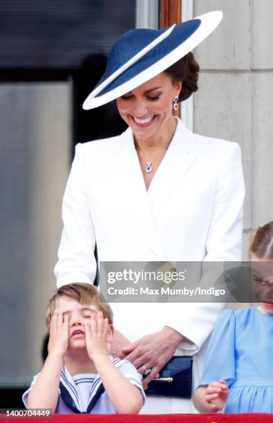 Prince Louis of Cambridge and Catherine, Duchess of Cambridge watch a flypast from the balcony of Buckingham Palace during Trooping the Colour on...