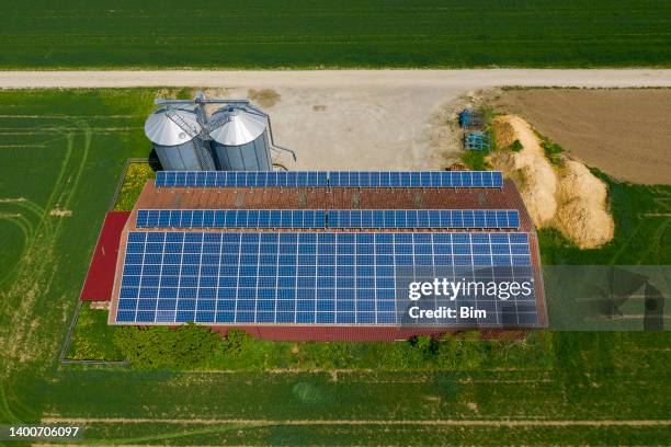 farm barn with solar panels, aerial view - rooftop farm stock pictures, royalty-free photos & images