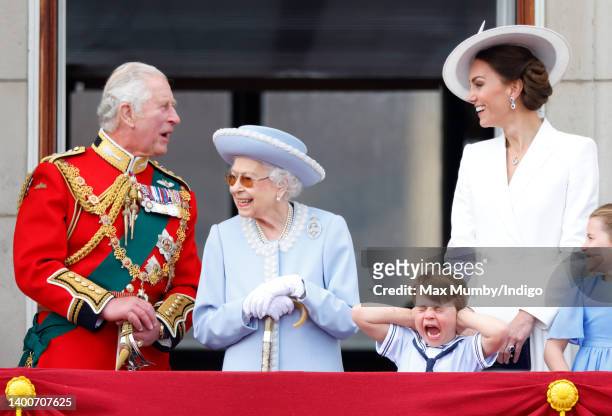 Prince Charles, Prince of Wales, Queen Elizabeth II, Prince Louis of Cambridge and Catherine, Duchess of Cambridge watch a flypast from the balcony...