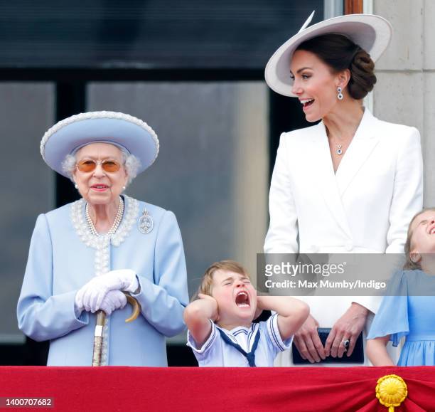 Queen Elizabeth II, Prince Louis of Cambridge and Catherine, Duchess of Cambridge watch a flypast from the balcony of Buckingham Palace during...