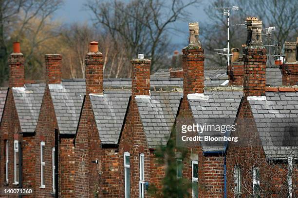 Semi detached residential houses are seen in Urmston, U.K., on Thursday, Feb. 23, 2012. U.K. House prices held their value for a second month in...