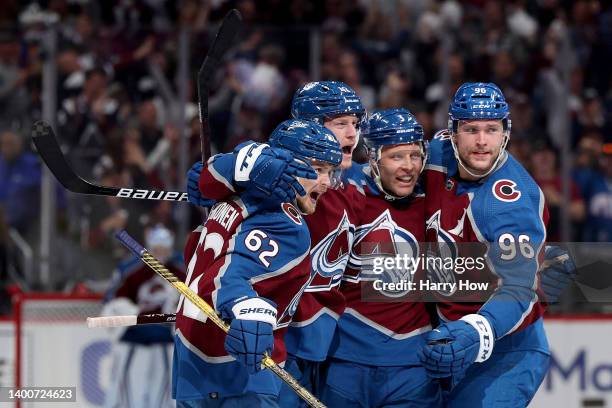 Josh Manson of the Colorado Avalanche celebrates with his teammates Artturi Lehkonen, Jack Johnson and Mikko Rantanen after scoring a goal on Mike...