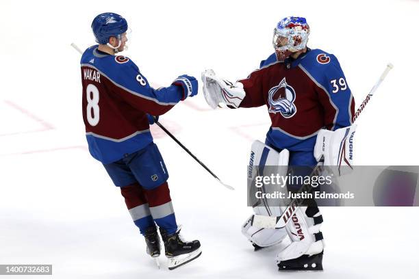 Cale Makar and Pavel Francouz of the Colorado Avalanche celebrate after defeating the Edmonton Oilers with a score of 4 to 0 in Game Two of the...