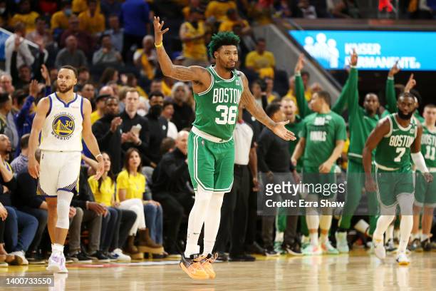 Marcus Smart of the Boston Celtics reacts after his three point basket against the Golden State Warriors during the fourth quarter in Game One of the...