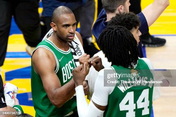 Al Horford and Robert Williams III of the Boston Celtics reac following the 120-108 victory against the Golden State Warriors in Game One of the 2022...