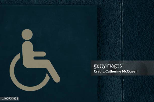 human rights: universal accessibility sign for persons with disabilities - handicap parking space stock pictures, royalty-free photos & images