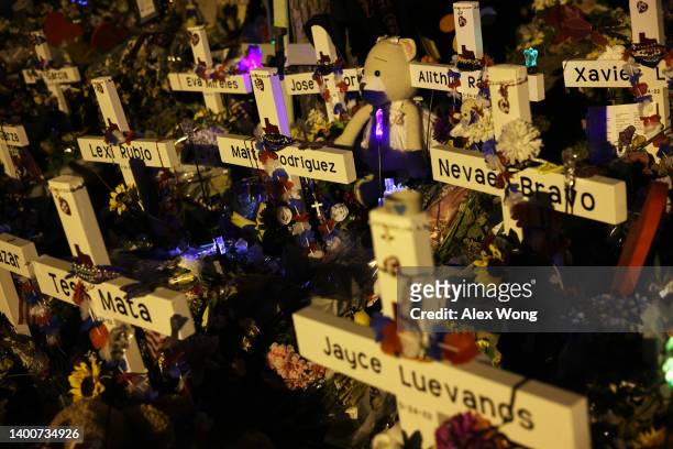 Flowers and plush toys are seen at a memorial dedicated to the victims of the mass shooting at Robb Elementary School on June 2, 2022 in Uvalde,...