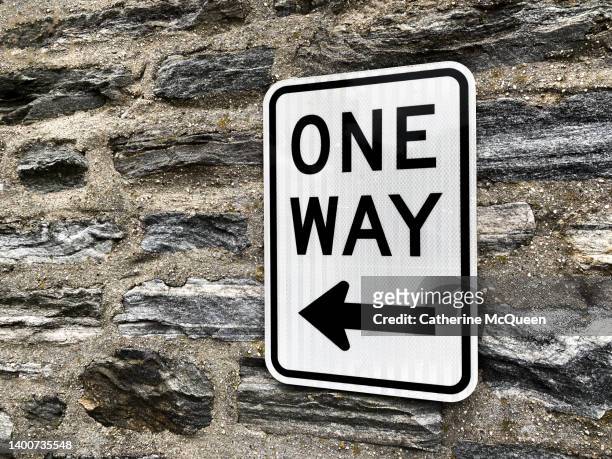one way road sign - one direction stock pictures, royalty-free photos & images