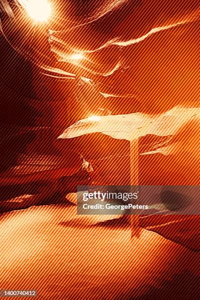 antelope canyon with sunbeams - antelope canyon stock illustrations