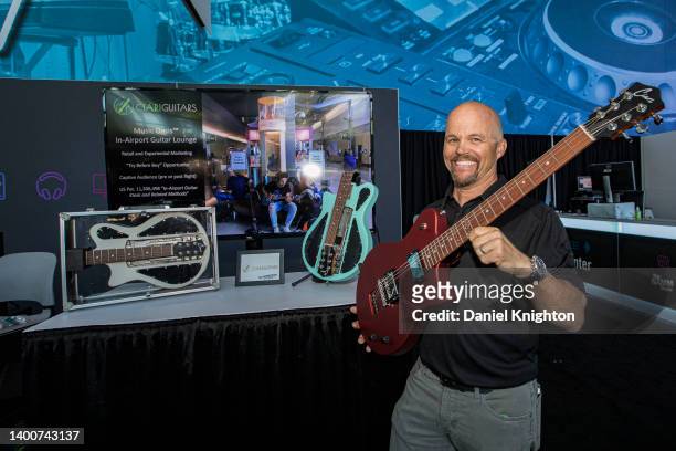 Jonathan Spangler of Ciari Guitars previews the new "Ascender" travel guitar at 2022 NAMM Show Media Preview Day at Anaheim Convention Center on June...