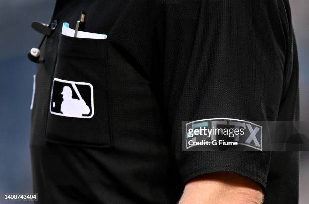 The FTX logo on the umpire's uniform during the game between the Washington Nationals and the Colorado Rockies at Nationals Park on May 26, 2022 in...