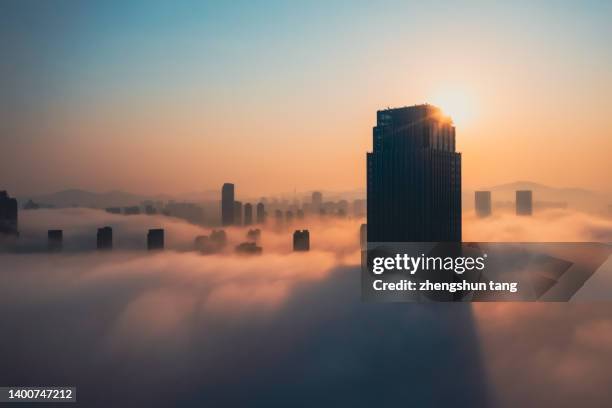 aerial view of office building in cloud. - rascacielos fotografías e imágenes de stock