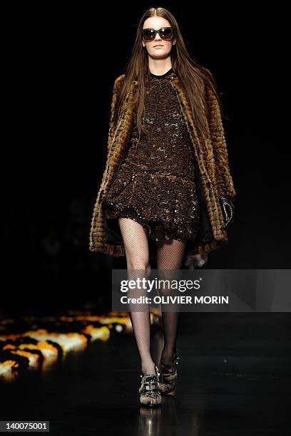 Model displays a creation as part of Roberto Cavalli Fall-winter 2012-2013 show on February 27, 2012 during the Women's fashion week in Milan. AFP...