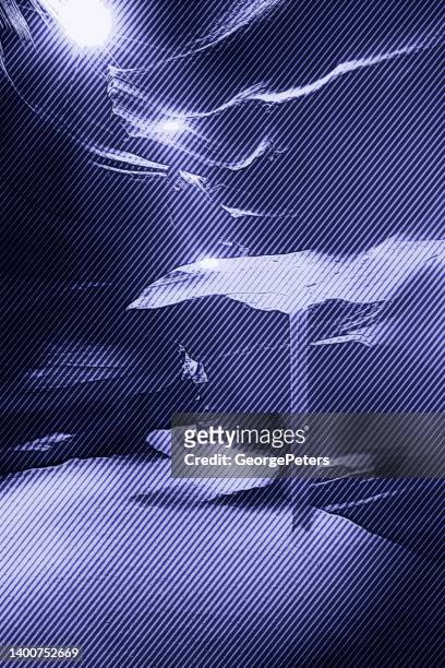 antelope canyon with sunbeams - sandstone stock illustrations