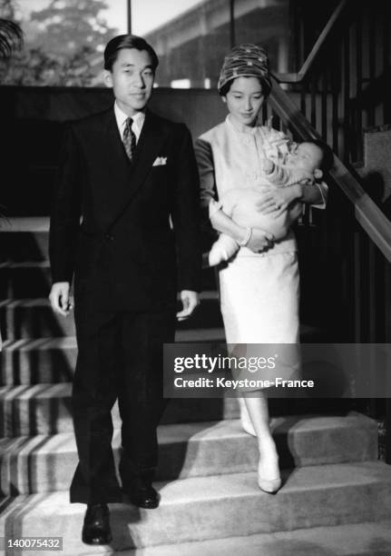 Crown Prince Akihito with wife Crown Princess Michiko with son Prince Naruhito in 1960 in Tokyo, Japan.