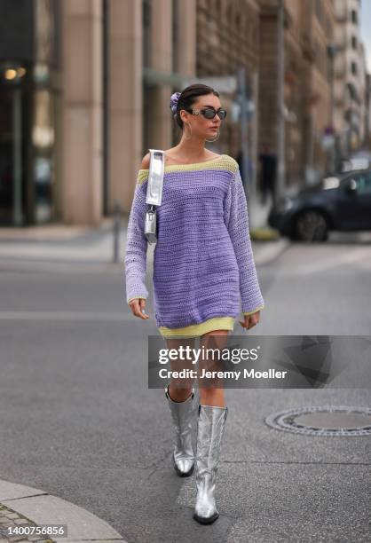 Celine Bethmann wearing Jacquemus silver bag, selfmade knit sweater, black shades and Topshop silver boots on May 31, 2022 in Berlin, Germany.