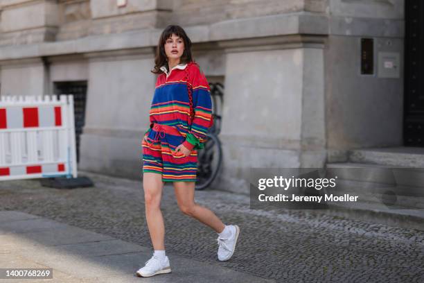 Lea Naumann wearing Polo Ralph Lauren colorful two piece, New Balance x Miu Miu white sneaker, Furla red mini bag, Missoma gold and silver armband on...