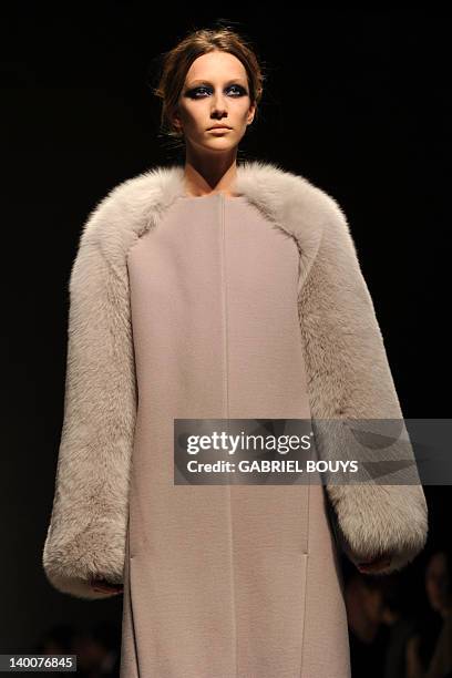 Model displays a creation as part of Gianfranco Ferre Fall-winter 2012-2013 show on February 27, 2012 during the Women's fashion week in Milan. AFP...