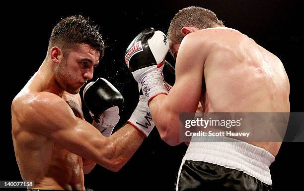 Nathan Cleverly in action with Tommy Karpency during the WBO Light-Heavyweight Championship bout at the Motorpoint Arena on February 25, 2012 in...