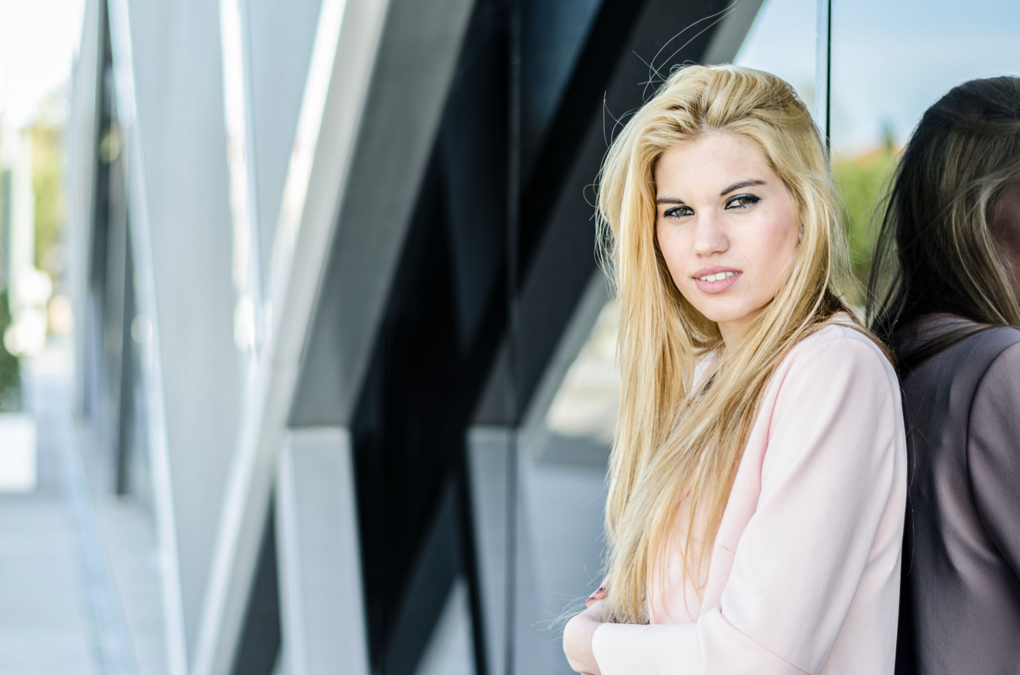 happy blonde young woman looking at camera happy blonde young woman looking at camera