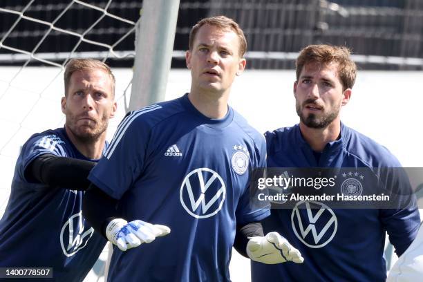 Manuel Neuer stands next to Oliver Baumann and Kevin Trapp during a training session of the German national soccer team at Adi-Dassler-Stadion of...
