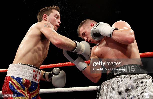 Lewis Ress in action with Tony Pace during their Light-Welterweight bout at the Motorpoint Arena on February 25, 2012 in Cardiff, Wales.