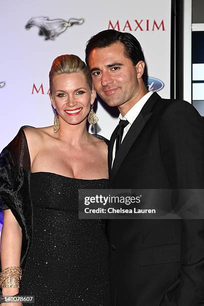 Actress Natasha Henstridge and singer-songwriter Darius Campbell arrive at the Maxim late night party with Ford Mustang Customizer on February 26,...