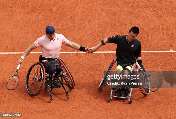 Shingo Kunieda of Japan and partner Gustavo Fernandez of Argentina celerate against Stephane Houdet of France and Nicolas Peifer of France during...