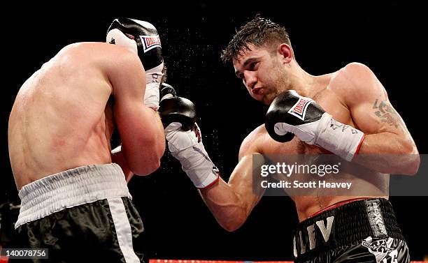 Nathan Cleverly in action with Tommy Karpency during the WBO Light-Heavyweight Championship bout at the Motorpoint Arena on February 25, 2012 in...