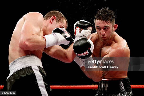 Nathan Cleverly in action with Tommy Karpency during the WBO Light-Heavyweight Championship bout at the Motorpoint Arena on February 25, 2012 in...