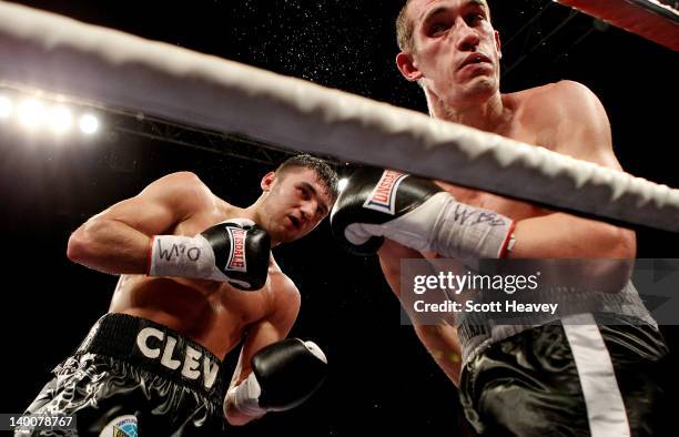 Nathan Cleverly in action with Tommy Karpency during the WBO Light-Heavyweight Championship bout at the Motorpoint Arena on February 25, 2012 in...