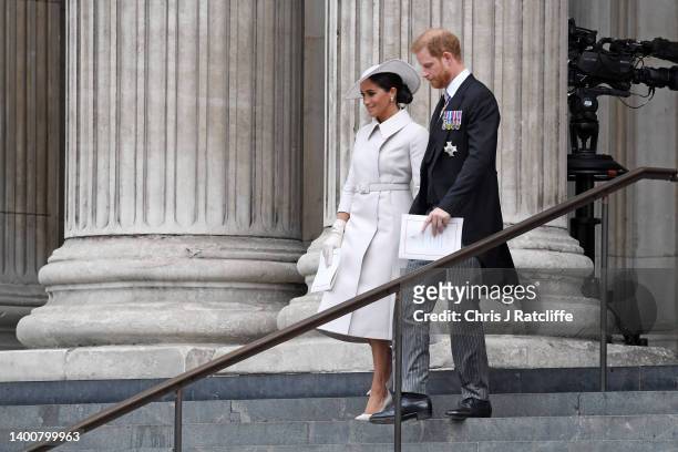 Meghan, Duchess of Sussex and Prince Harry, Duke of Sussex depart the National Service of Thanksgiving at St Paul's Cathedral on June 03, 2022 in...