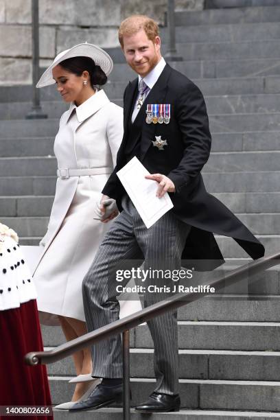 Meghan, Duchess of Sussex and Prince Harry, Duke of Sussex depart the National Service of Thanksgiving at St Paul's Cathedral on June 03, 2022 in...