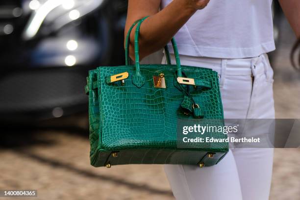 Close-up view of a green crocodile pattern Hermes Birkin leather