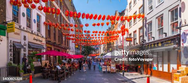 london chinatown red lanterns over busy chinese restaurants soho panorama - covent garden stock pictures, royalty-free photos & images