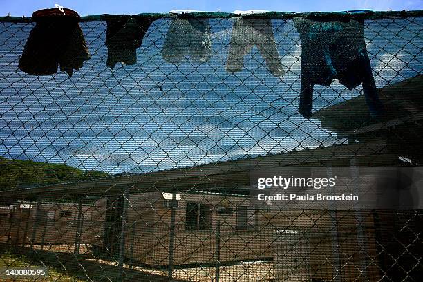 Laundry is seen hanging on a the fence at the Construction camp detention center February 27, 2012 on Christmas Island, Australia. The camp is used...