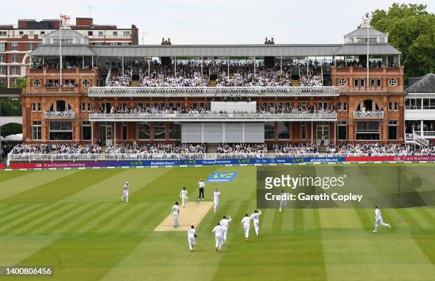 James Anderson of England celebrates after dismissing Will Young of New Zealand during day two of the First LV= Insurance Test match between England...