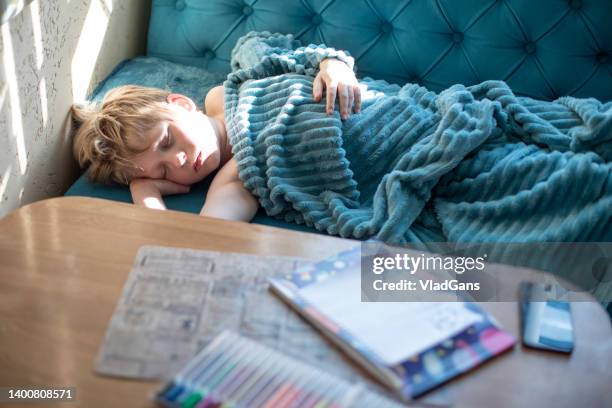 young boy enjoying weekend nap - sleeping boys stockfoto's en -beelden