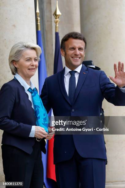 French President Emmanuel Macron welcomes European Commission President Ursula von der Leyen prior to a working lunch at the Elysee Palace on June...